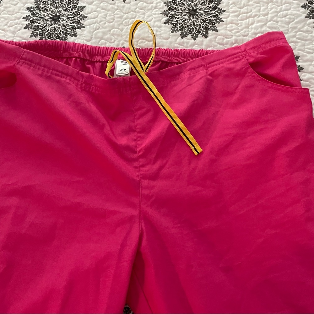 Pink scrubs. Pants are 2X petite.